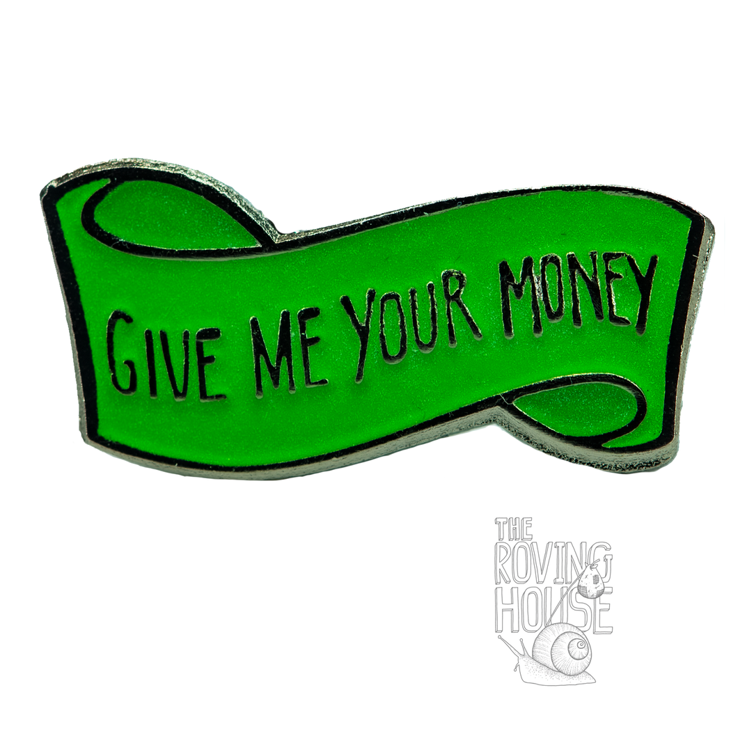 An enamel pin of a floating green banner that reads 