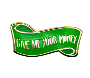 An gold-outlined hard enamel pin of a floating green banner that reads "GIVE ME YOUR MONEY".