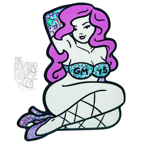 A glittery vinyl sticker of a pale, curvy woman with purple hair, gloves, and heels, and a blue strapless bra that reads 