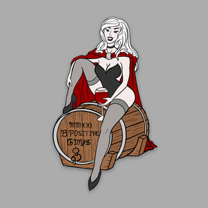 A femme vampire sits atop a wine cask suggestively. Her cape comes down to the ground behind her. She holds a glass of red liquid. Writing on the cask says "MMXXI B POSITIVE GMY$".