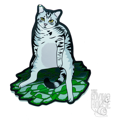 A shiny sticker of a grey striped cat, sitting like a person on a pile of money.